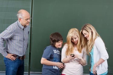 Angry teach looking down at social children