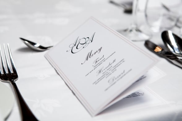 Menu on Table with silverware and tablecloth