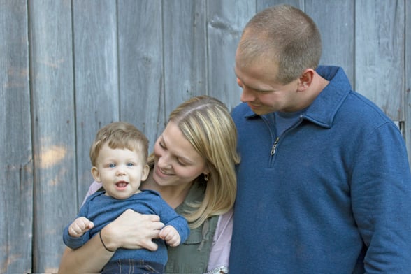 Parents holding young toddler