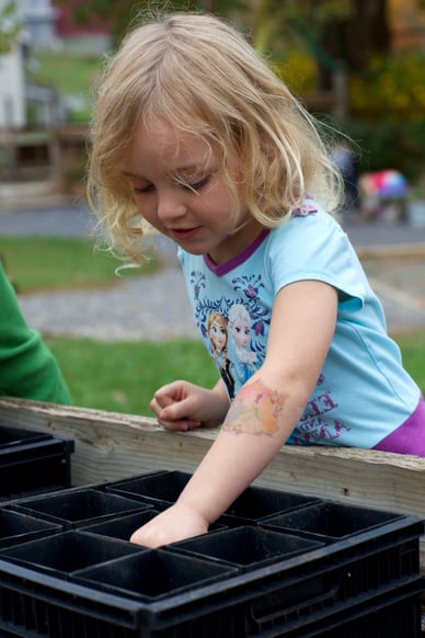 Preschool Girl Doing an Outdoor Gardenign Activity