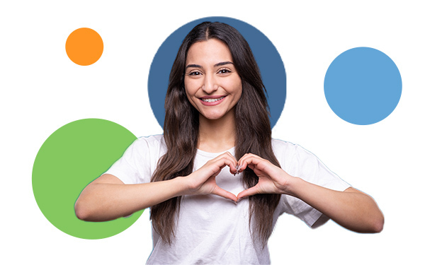 Smiling woman making a heart shape with her hands, surrounded by colorful circles, symbolizing streamlined systems and self-care.