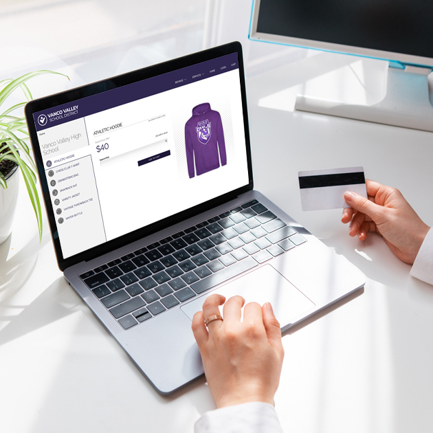 customer making a purchase on a school spirit wear store