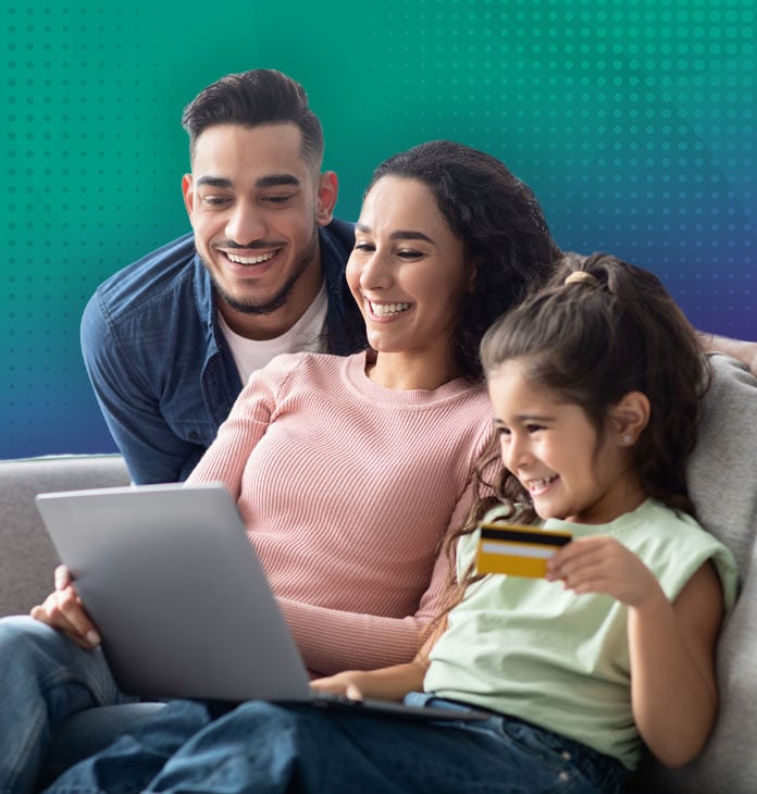 family-smiling-at-a-laptop