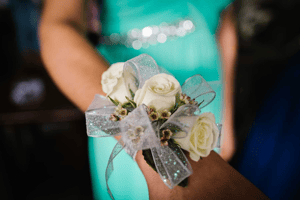 Image of a girl at prom showing her flower corsage 