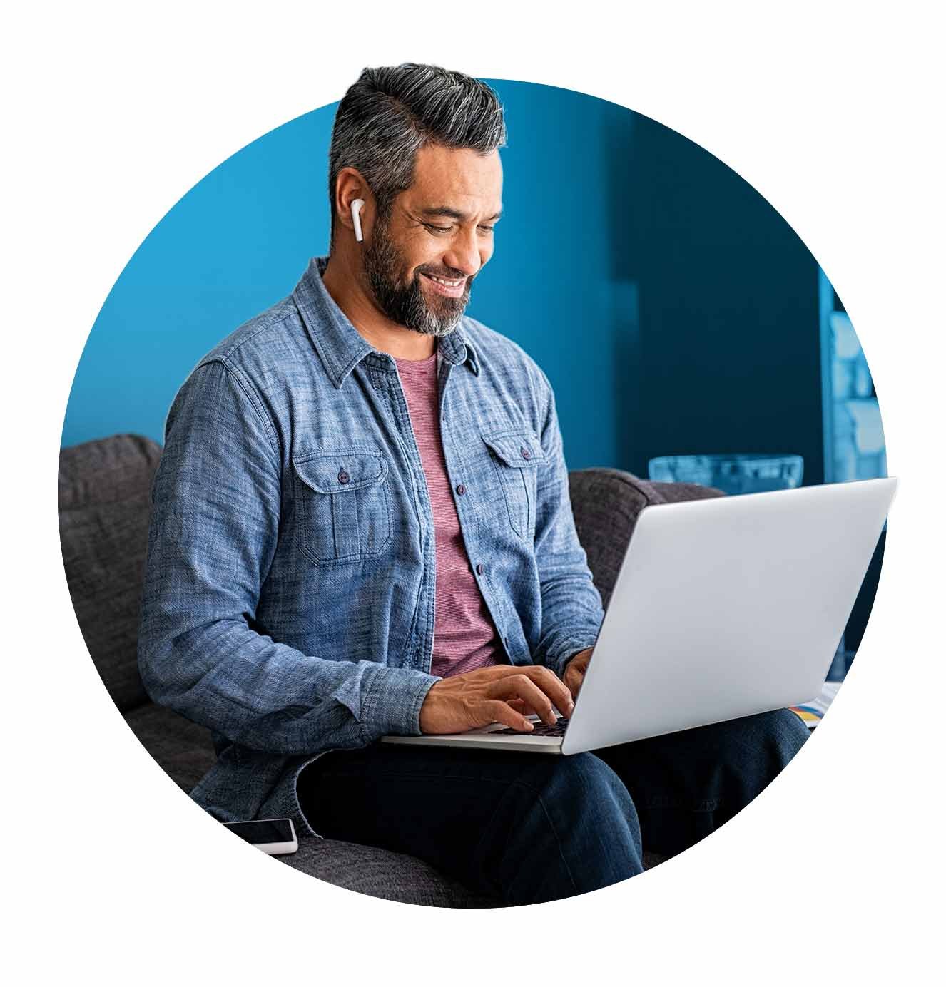 man typing at computer
