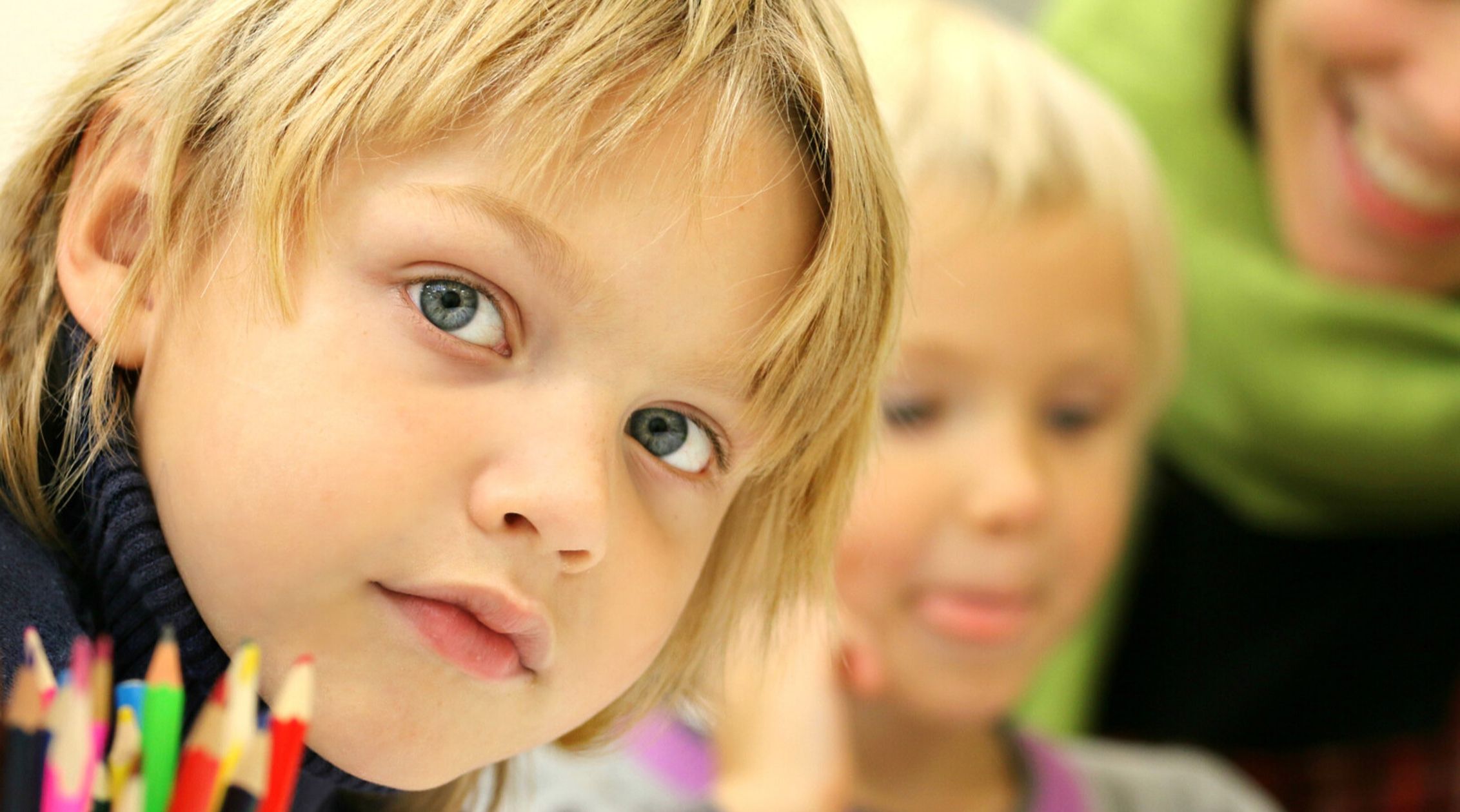 children in classroom with teacher
