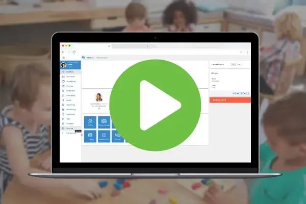 Laptop displaying Smartcare software interface with a large green play button, promoting a webinar.