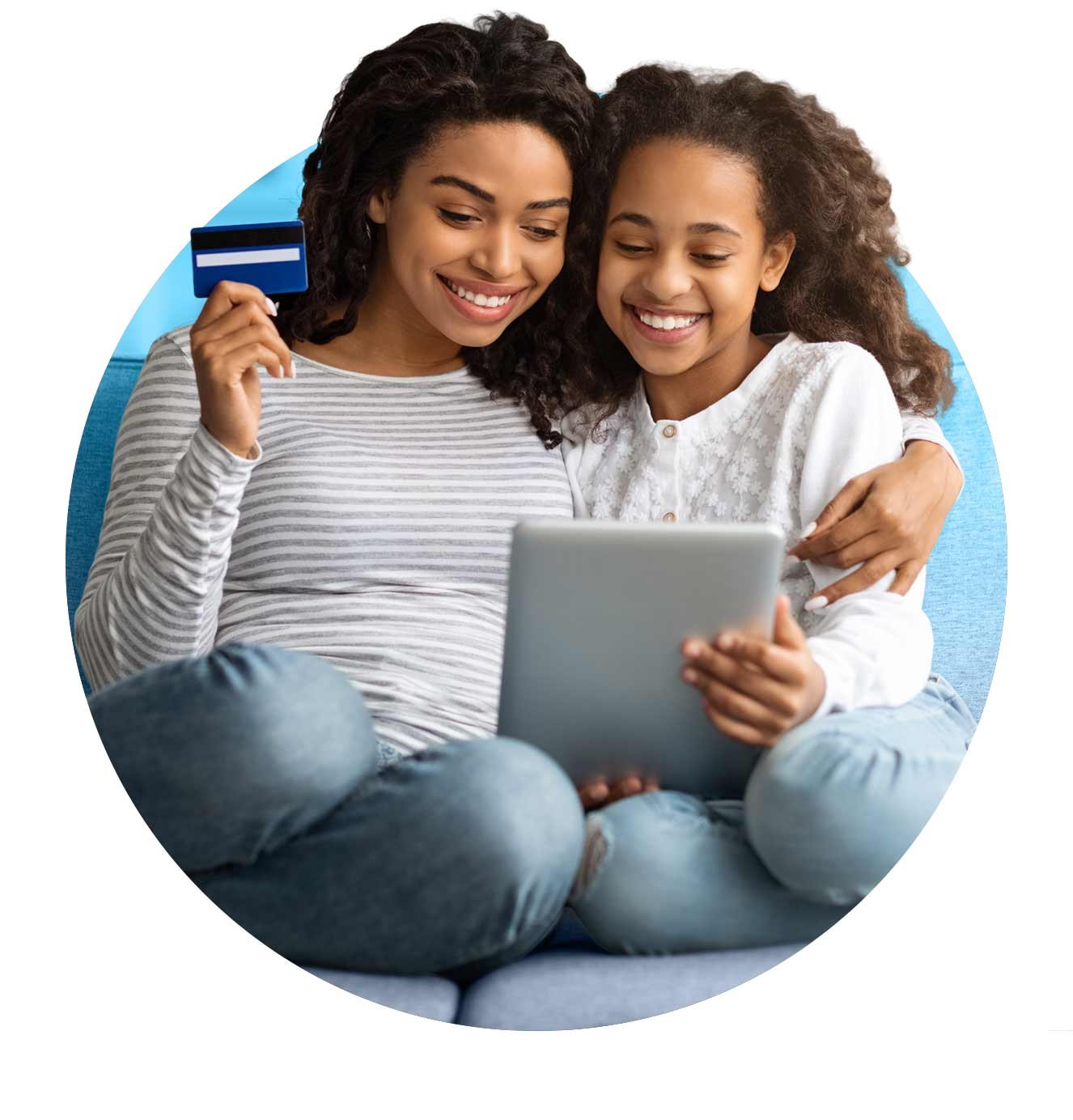 mother and daughter making payment on tablet