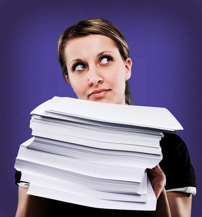 woman-with-stack-of-paper