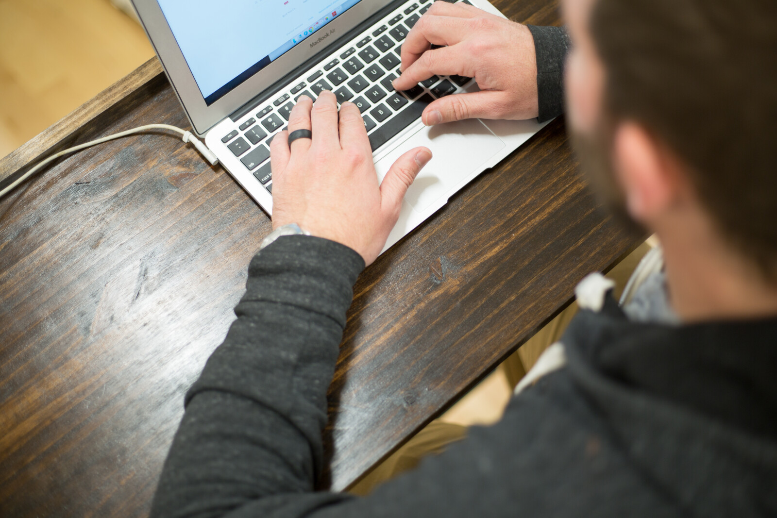 A dad donating online to his childs school using Vanco