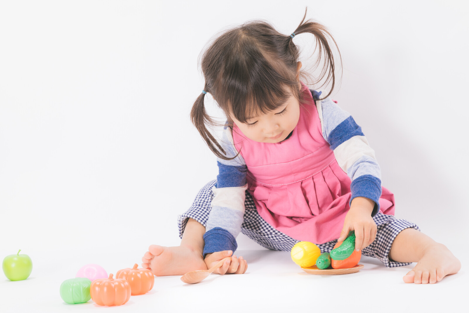 Preschool student playing with toys
