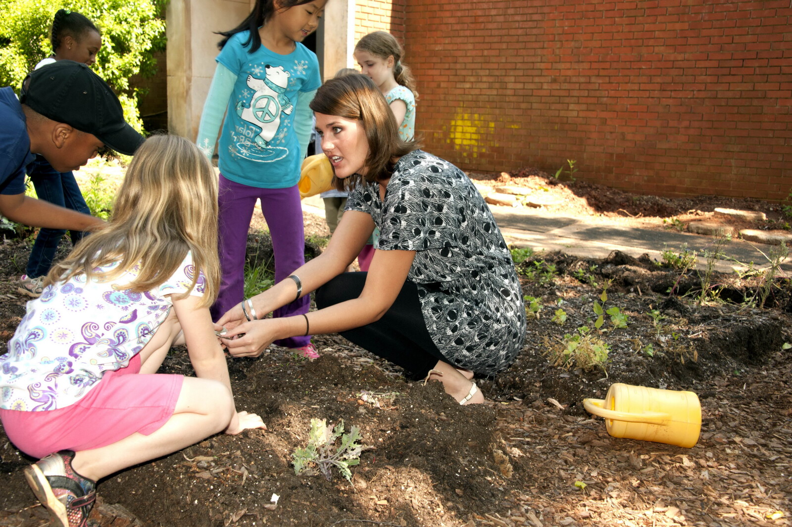 Teacher and students during school fundraising event